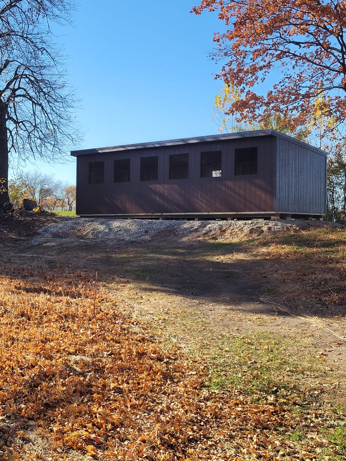 Heated 5-stand shooting shelter along the tree line