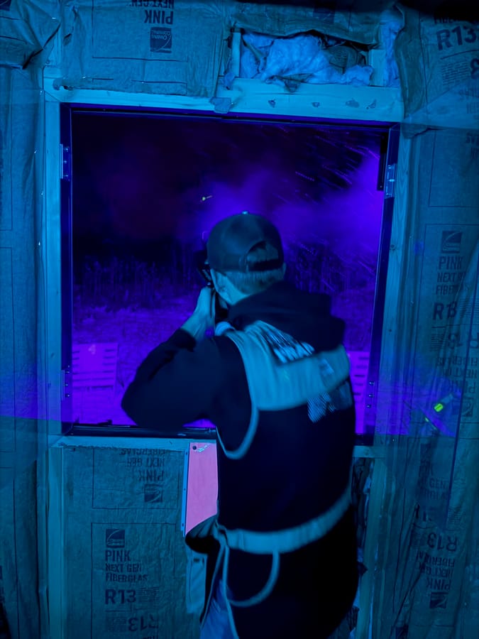 Shooter at the heated 5-stand at night