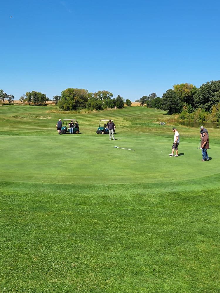 Group of golfers with carts