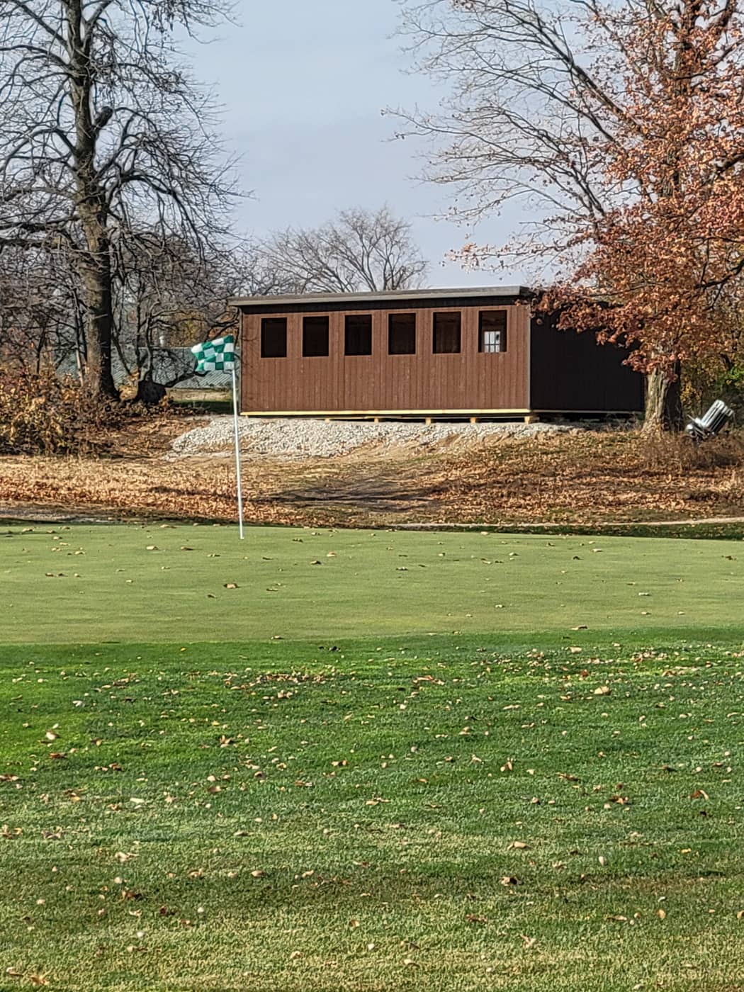 Exterior of the heated 5-stand shooting shelter in fall